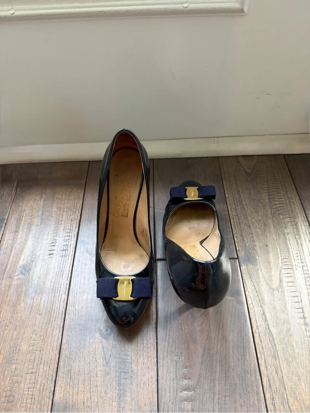 Salvatore Ferragamo Navy Patent Pumps with Navy Bow and Gold Plaque